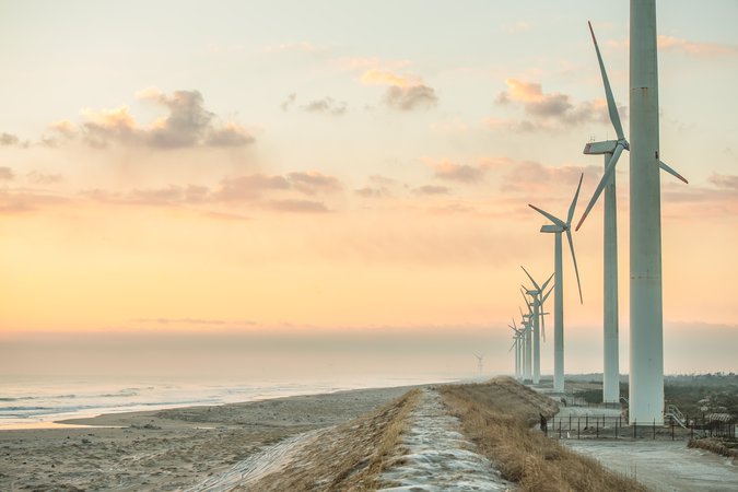 Windmills by ocean sunset.jpg